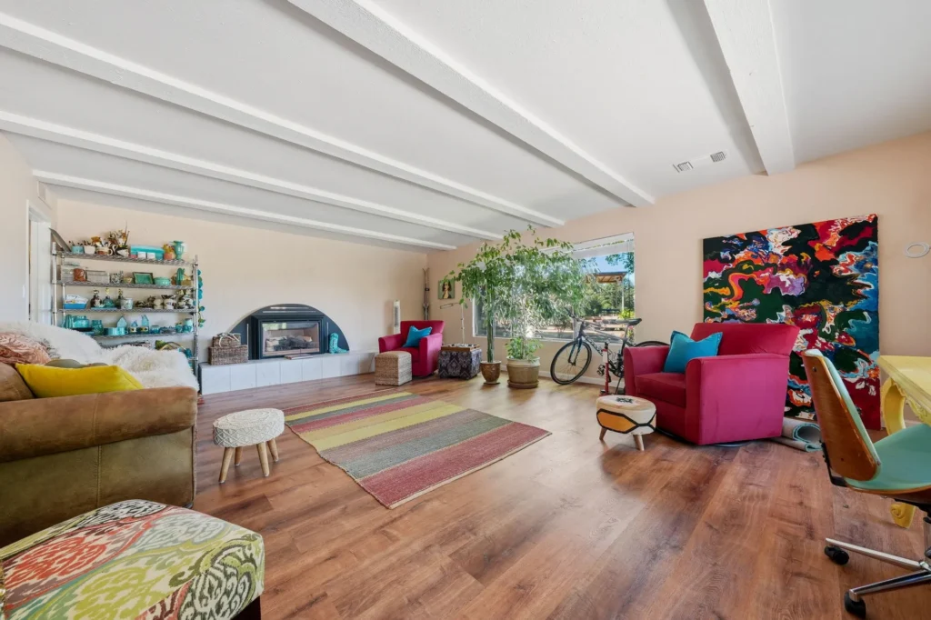 Open living area with large windows and natural light.
