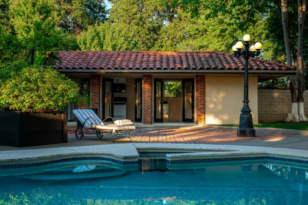 Swimming pool reflecting evening light at golden hour.